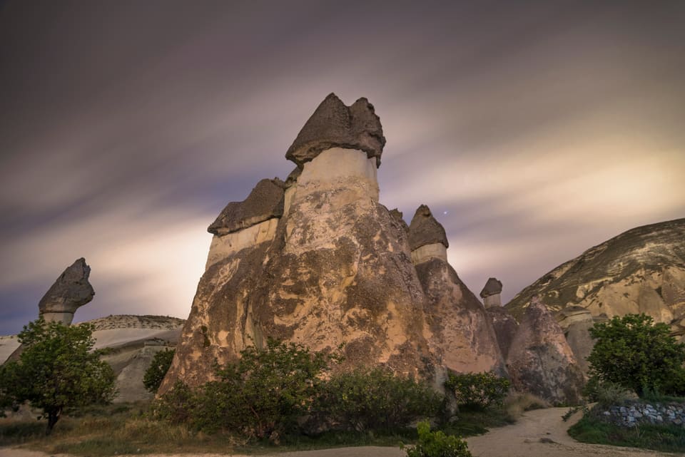 The capped fairy chimneys of Paşabağ under a cloudy sky